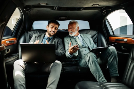 Two Businessmen with Laptops in Luxury Limo, RNR